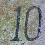 The number "10" etched into stone.
