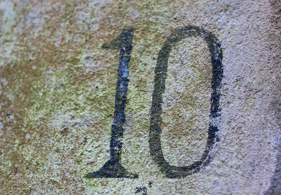 The number "10" etched into stone.
